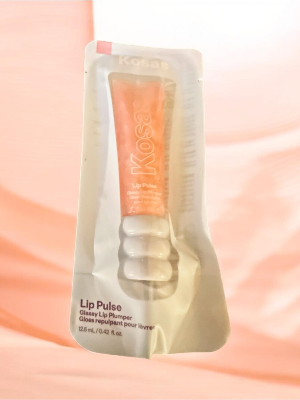 Kosas Lip Pulse Glossy Lip Plumper — Peach Coral Shine